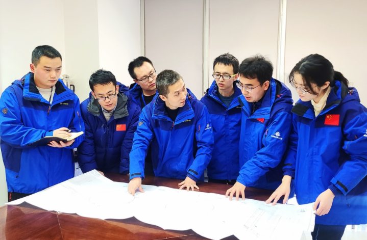 Process engineering team reviewing drawings